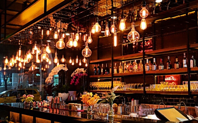 dark themed bar with orange ambient lights